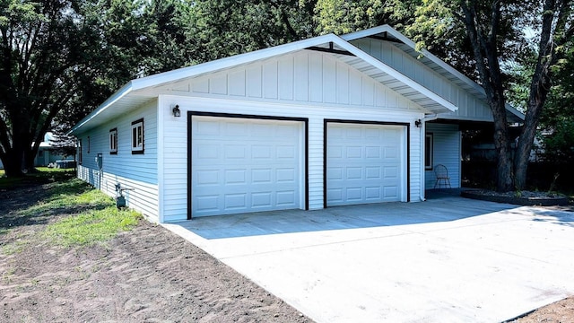 garage featuring wooden walls