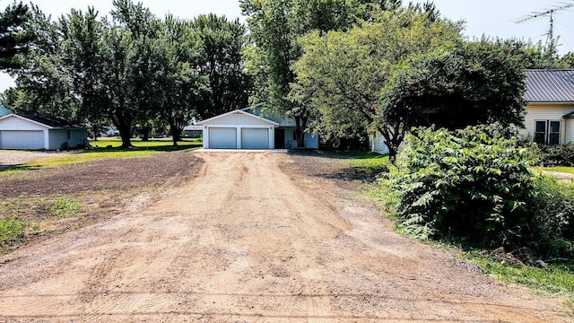 view of front facade with an outdoor structure and a garage