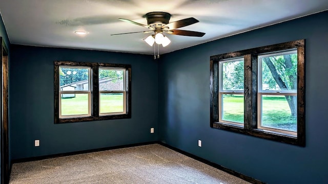 carpeted empty room with ceiling fan