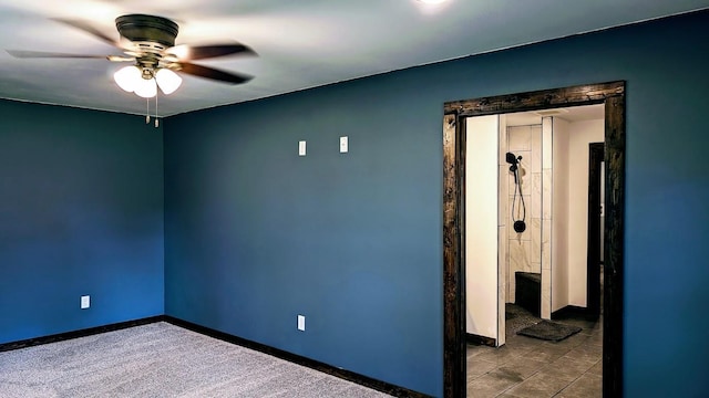 unfurnished room with ceiling fan and carpet floors