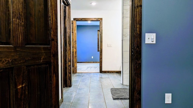 corridor with light tile patterned floors