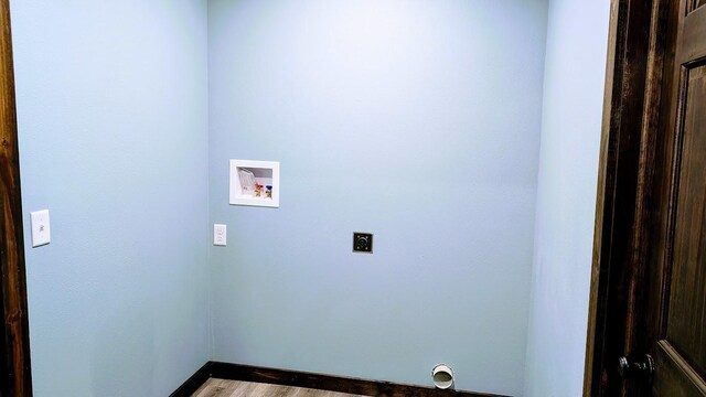 laundry area featuring wood-type flooring, hookup for an electric dryer, and washer hookup