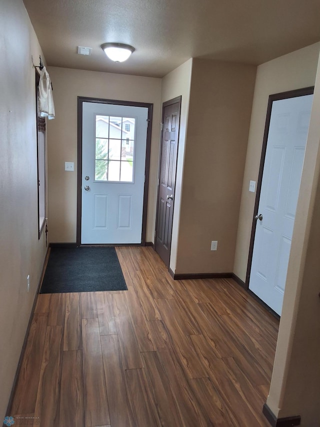 915 30th Ave W, West Fargo, ND 58078 - entryway with dark wood-style floors and a textured ceiling