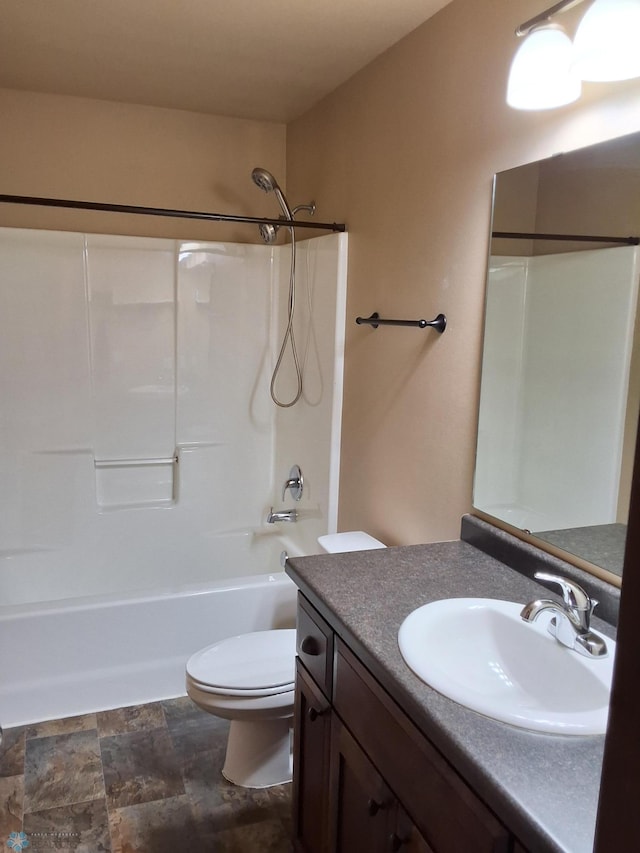 915 30th Ave W, West Fargo, ND 58078 - bathroom featuring vanity, bathing tub / shower combination, and stone finish flooring