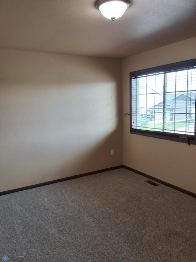 915 30th Ave W, West Fargo, ND 58078 - carpeted empty room featuring baseboards