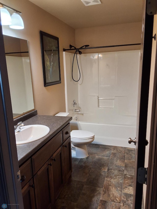 915 30th Ave W, West Fargo, ND 58078 - full bath featuring vanity, stone finish flooring, and shower / bathtub combination
