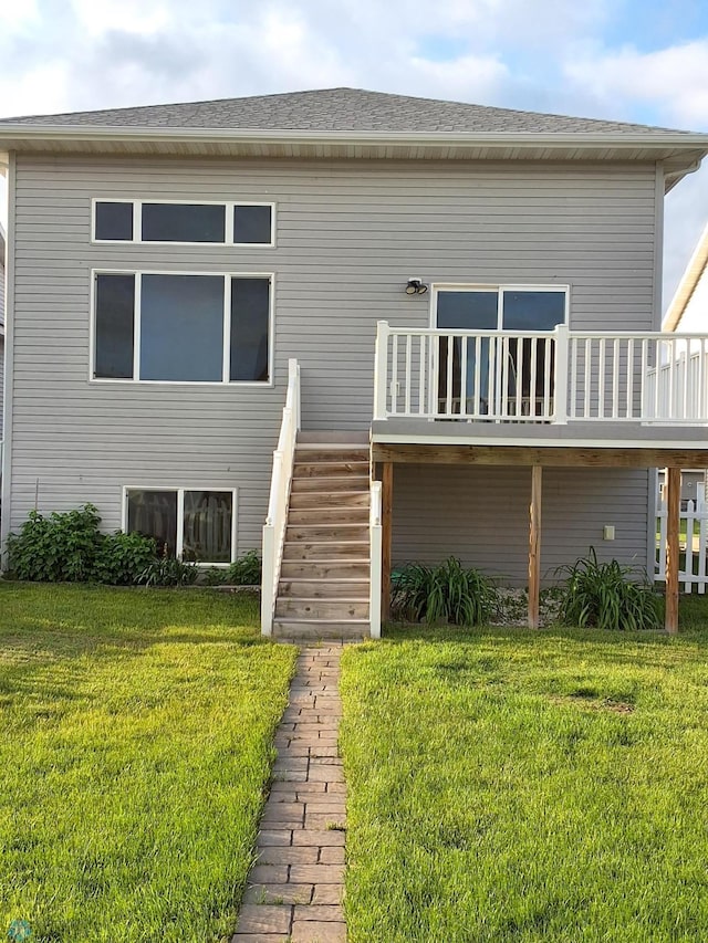 915 30th Ave W, West Fargo, ND 58078 - rear view of house featuring a yard, stairway, and a deck