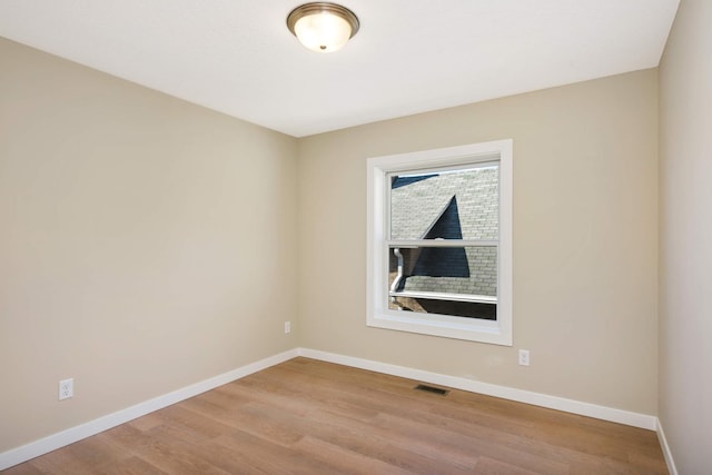 unfurnished room with light hardwood / wood-style flooring