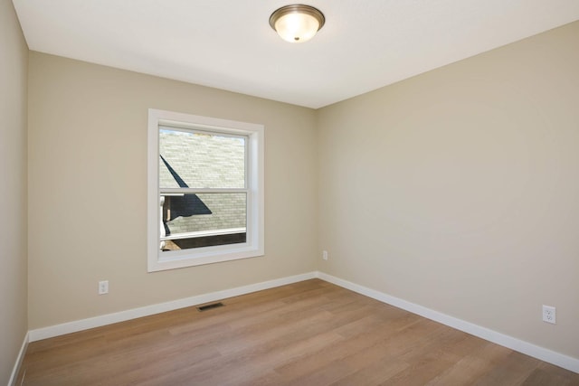 empty room with light wood-type flooring