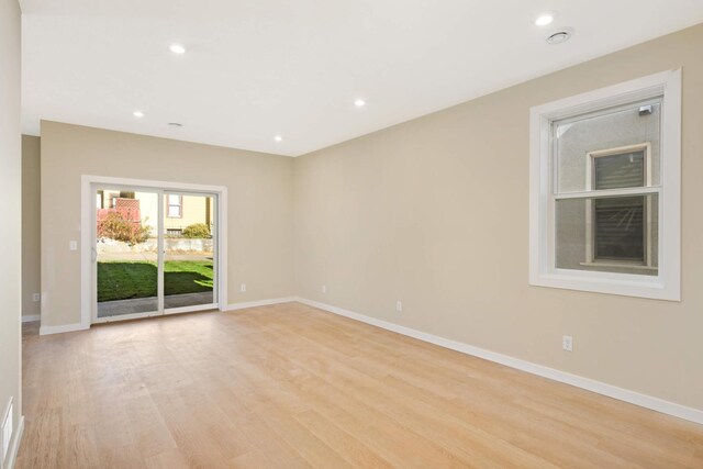 unfurnished room featuring light wood-type flooring