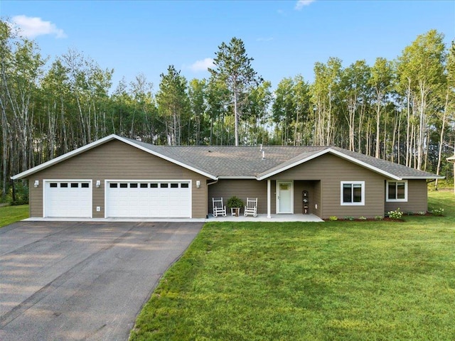 single story home featuring a garage and a front lawn