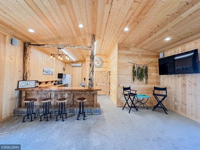 bar with wooden walls, pendant lighting, wooden ceiling, white fridge, and a wall unit AC