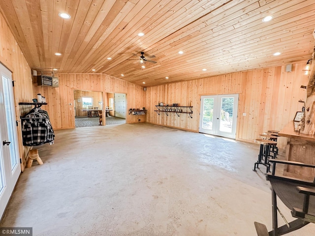 misc room with ceiling fan, concrete flooring, french doors, wooden ceiling, and lofted ceiling