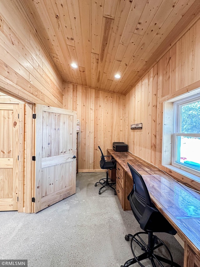 office area with wood ceiling, light colored carpet, and wooden walls