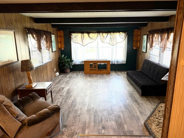 2769 28th St NW Unit 140, Wheeler Twp, MN 56623 - sitting room with wood walls and beamed ceiling