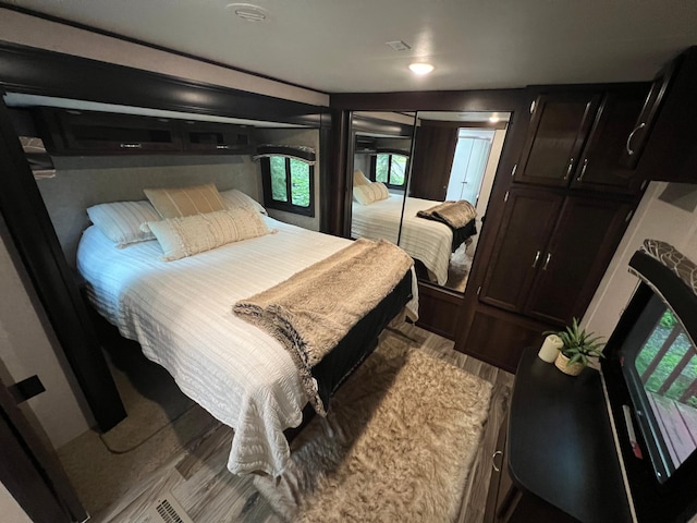 bedroom featuring light wood-style flooring