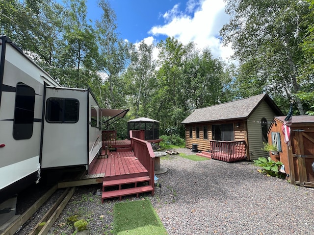 view of yard with a wooden deck