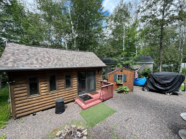 log cabin with a storage shed