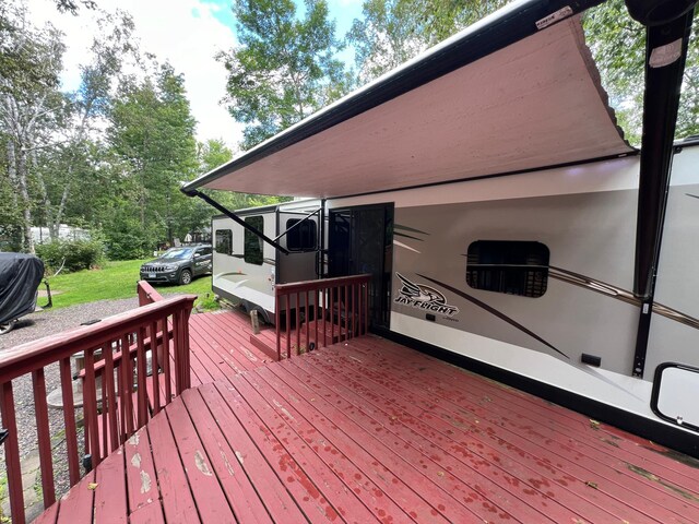 deck featuring a lawn