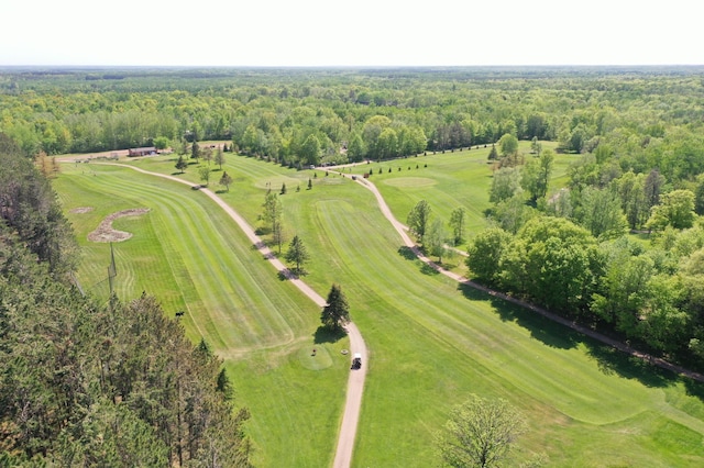 birds eye view of property with a forest view