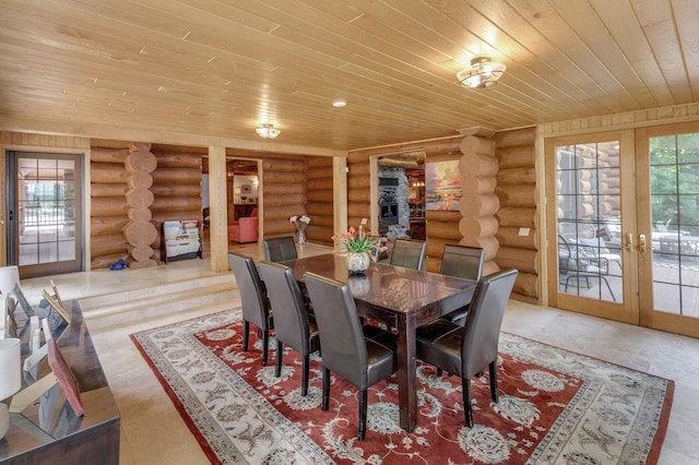 dining room with wooden ceiling, rustic walls, and french doors