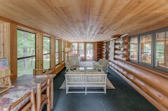 unfurnished sunroom featuring plenty of natural light and wood ceiling