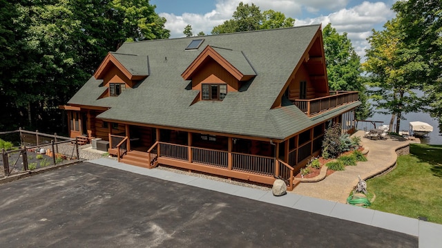 cabin with a balcony and a patio