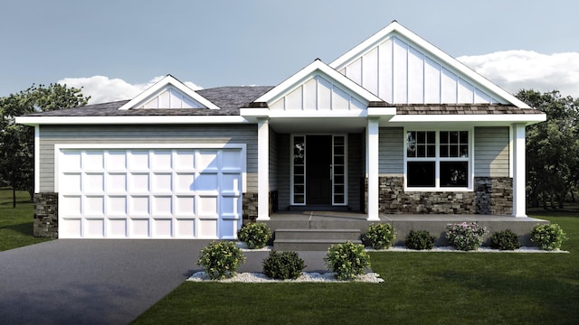 view of front of home featuring a garage and a front lawn