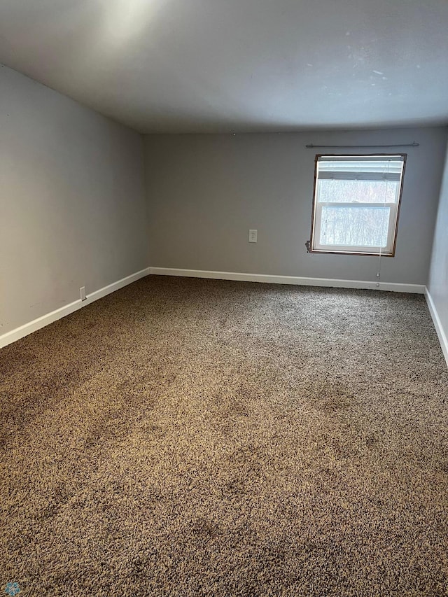 unfurnished room with carpet floors