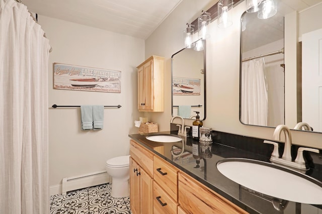 bathroom featuring a baseboard heating unit, vanity, toilet, and tile patterned flooring