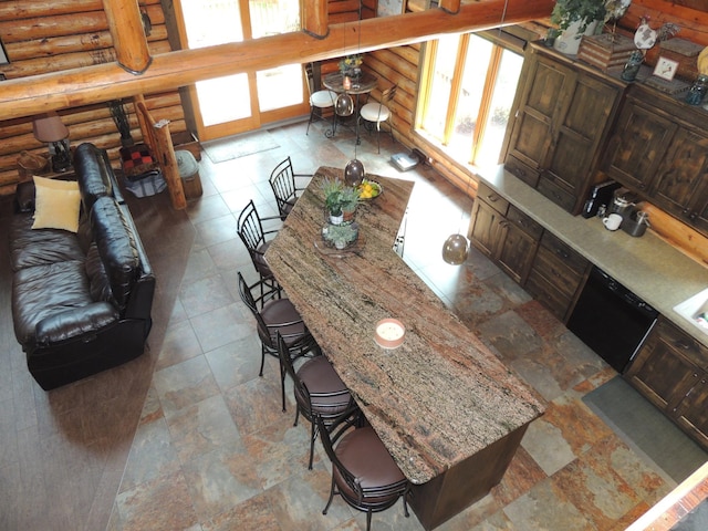 20578 317th St, Farming Twp, MN 56310 - kitchen featuring a breakfast bar, black dishwasher, and rustic walls