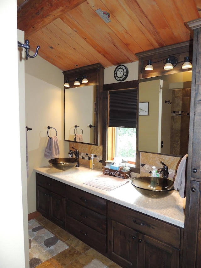 bathroom featuring vanity, wood ceiling, and backsplash