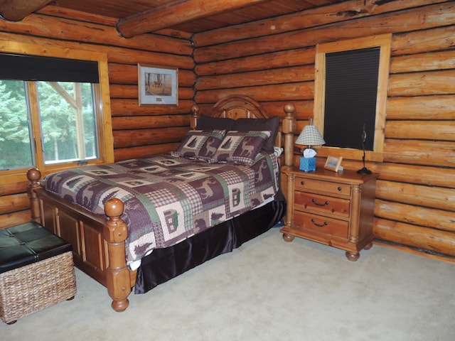 carpeted bedroom with log walls, beamed ceiling, and wood ceiling