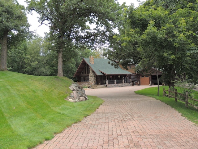 20578 317th St, Farming Twp, MN 56310 - view of community featuring a yard, decorative driveway, and fence