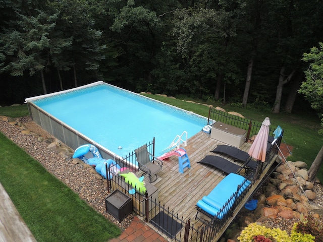 view of pool featuring a wooden deck