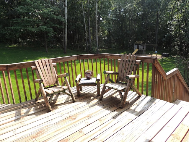 wooden terrace with a yard