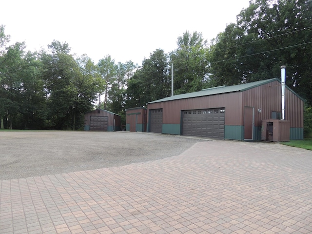 garage featuring wooden walls