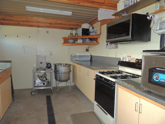 20578 317th St, Farming Twp, MN 56310 - kitchen featuring stainless steel microwave, gas range oven, open shelves, and concrete flooring