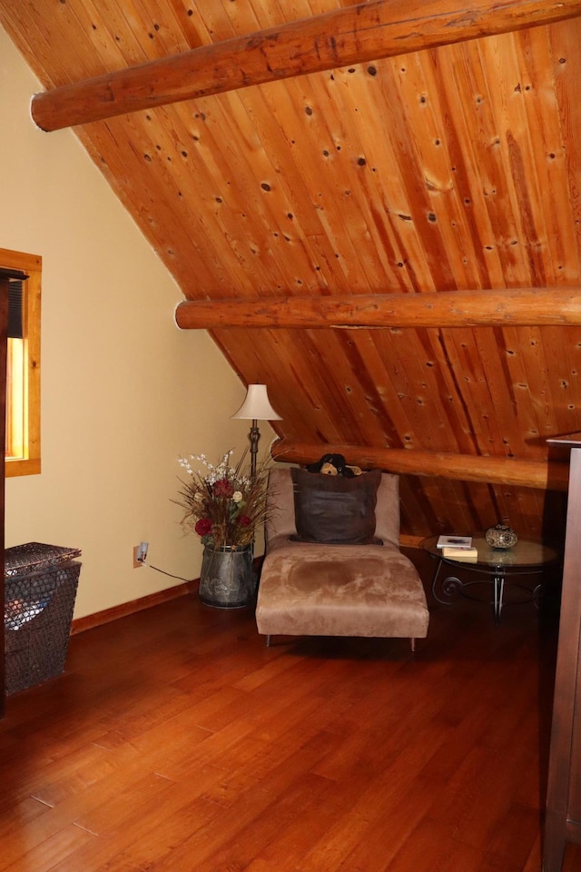 unfurnished room featuring wooden ceiling, vaulted ceiling with beams, and hardwood / wood-style flooring