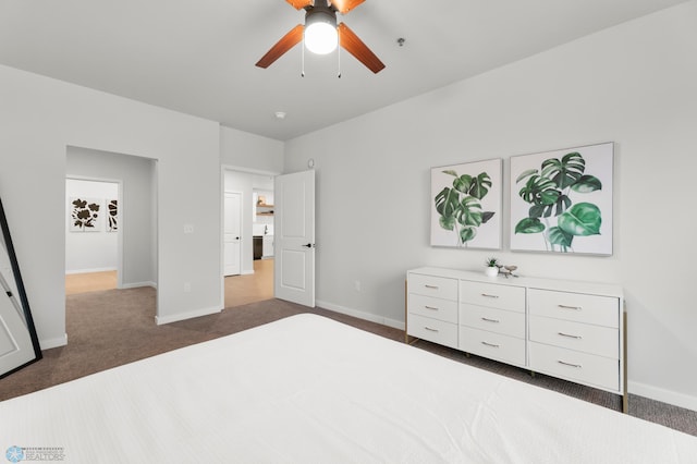 unfurnished bedroom featuring dark colored carpet and ceiling fan