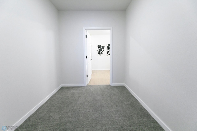 corridor with carpet flooring