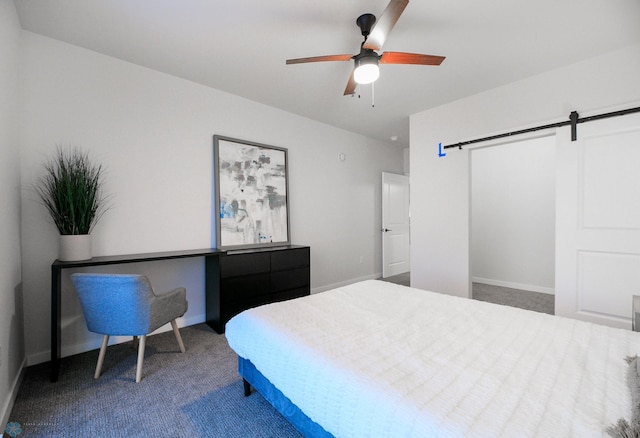 bedroom with a barn door, ceiling fan, and carpet flooring