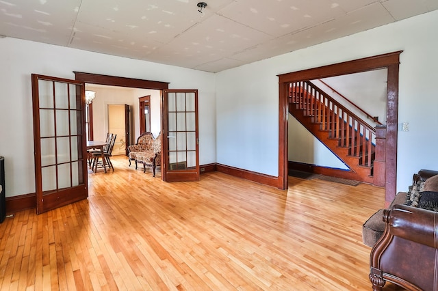 interior space featuring french doors and light hardwood / wood-style floors