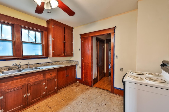 kitchen featuring ceiling fan, sink, light wood-type flooring, and white electric range