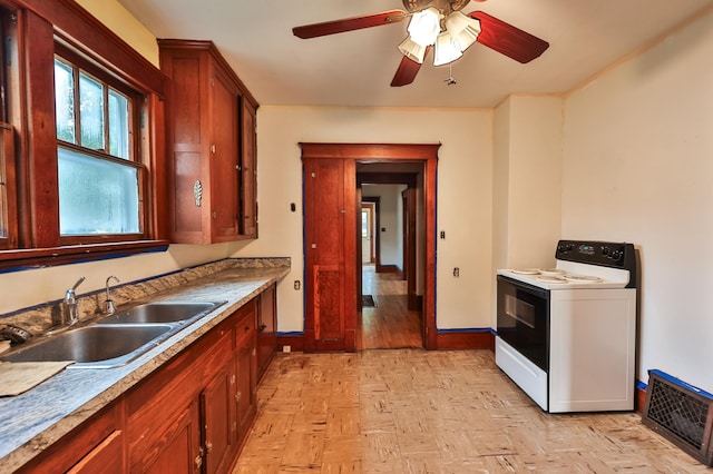 kitchen with ceiling fan, sink, and white electric range