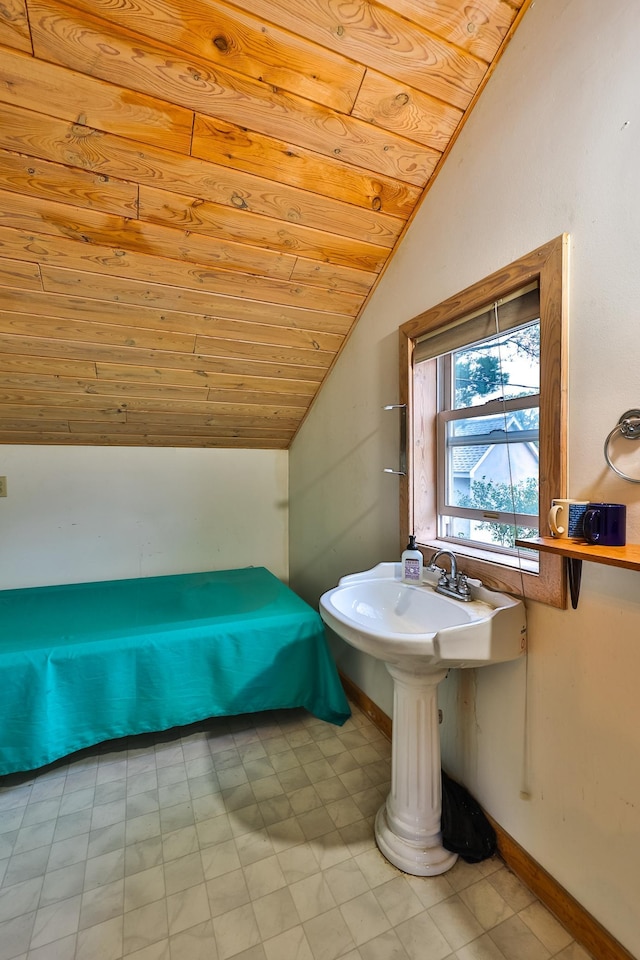 bathroom featuring lofted ceiling and wood ceiling