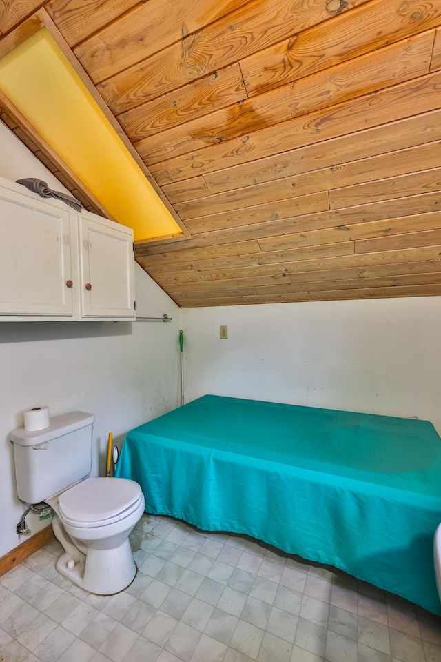 bathroom featuring wooden ceiling, lofted ceiling, and toilet