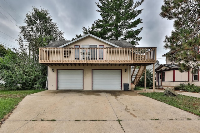 front facade featuring a garage and a deck