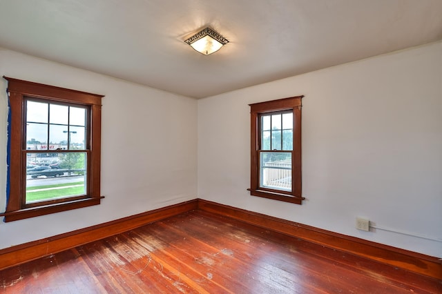 unfurnished room featuring dark hardwood / wood-style floors