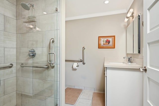 bathroom featuring tile patterned flooring, ornamental molding, vanity, and a shower with shower door